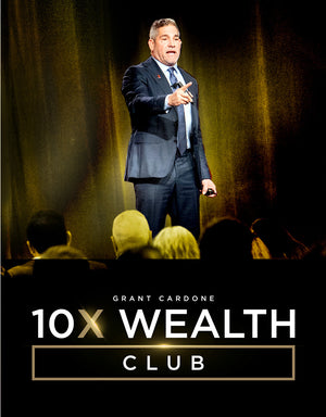 Grant Cardone speaking on stage at the 10X Wealth Club event, pointing towards an attentive audience in a theater with yellow lighting, engaging participants in wealth-building strategies.
